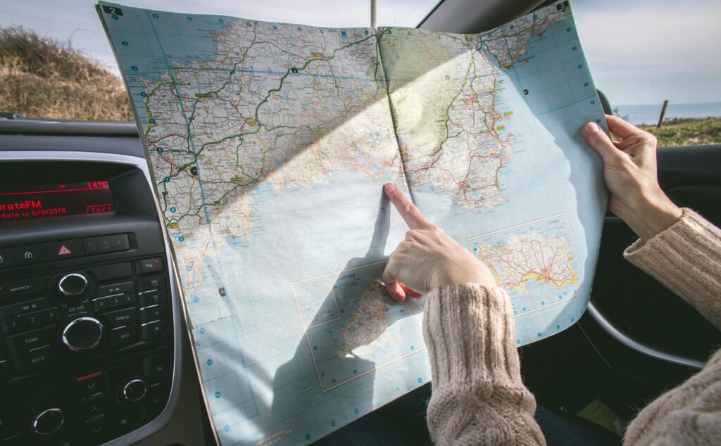 A person holding a map depicting increase in travel due to digital  influencer marketing 